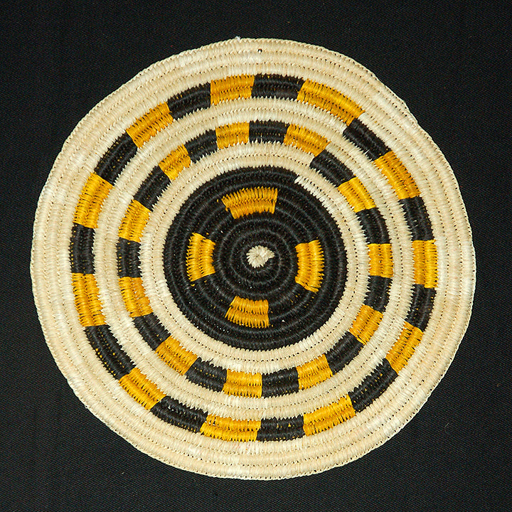 Woven hot pad (trivet) and center piece with black and yellow bands
