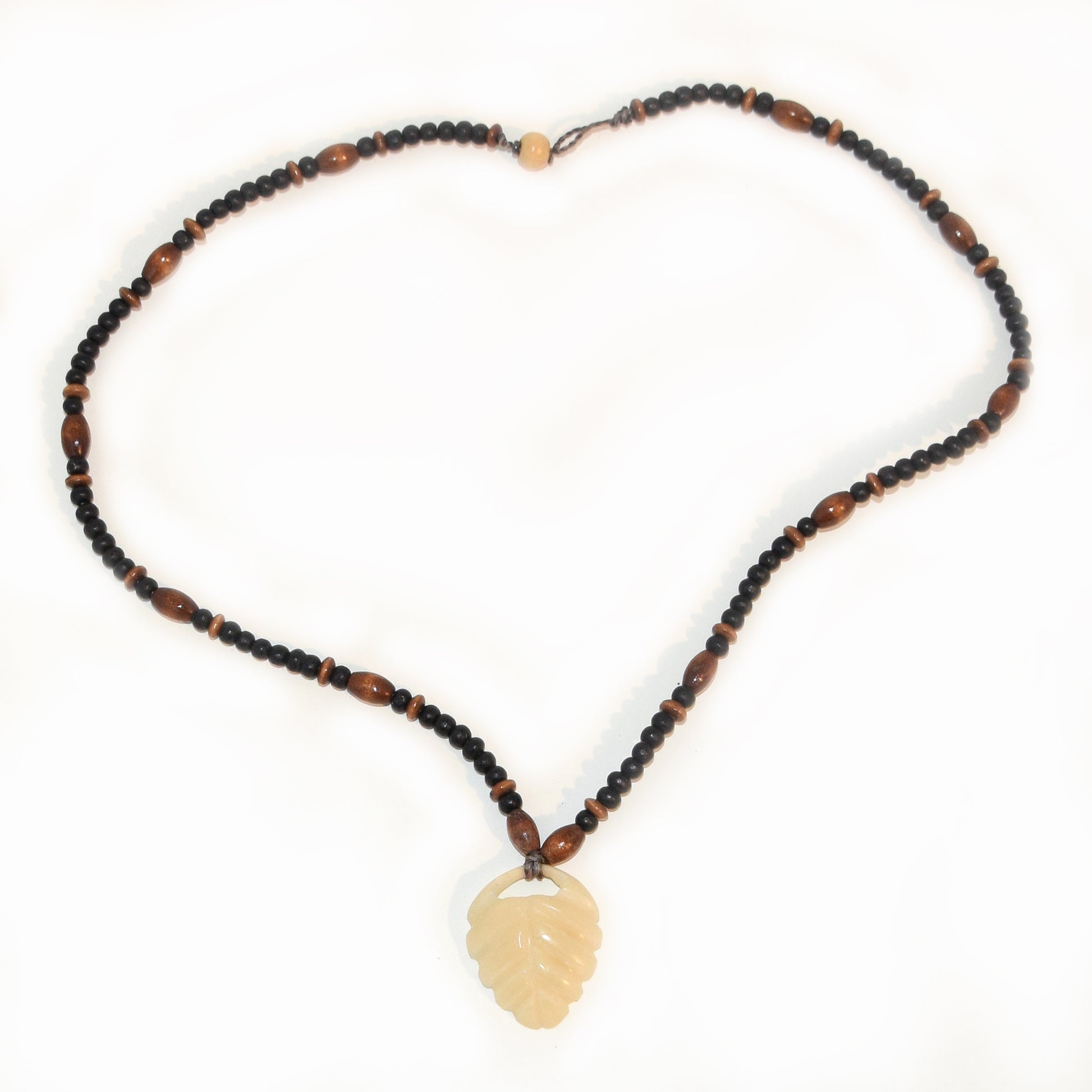 Carved tagua palm nut pendant and wooden bead necklace - made by an artisan from the Peruvian Amazon - Amazon Ecology